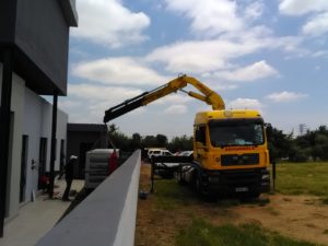 Crane truck placing generator